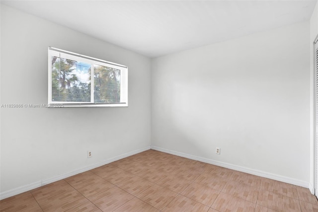 2106 S Cypress Bend Dr Unit 203, Pompano Beach, FL 33069 - spare room with baseboards