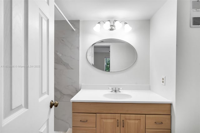 2106 S Cypress Bend Dr Unit 203, Pompano Beach, FL 33069 - bathroom with vanity and a chandelier