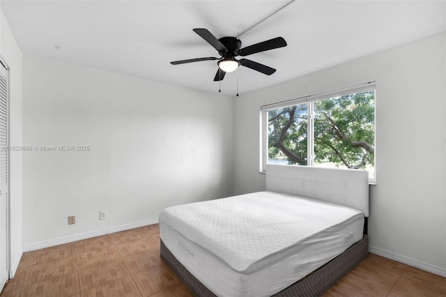 2106 S Cypress Bend Dr Unit 203, Pompano Beach, FL 33069 - bedroom with baseboards and a ceiling fan