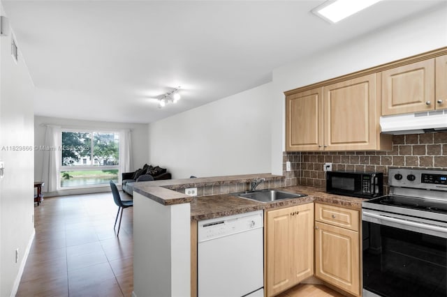 2106 S Cypress Bend Dr Unit 203, Pompano Beach, FL 33069 - kitchen featuring white dishwasher, stainless steel electric stove, under cabinet range hood, black microwave, and a peninsula