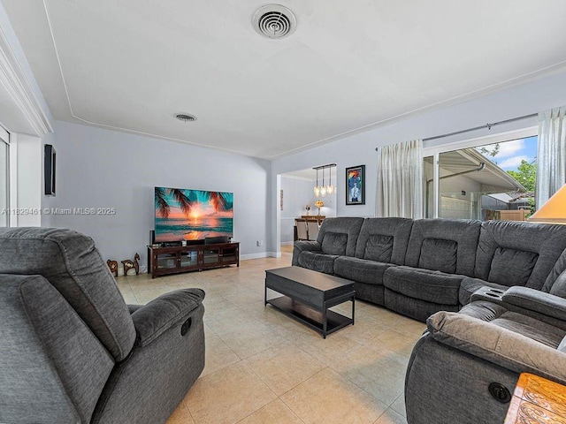 13530 SW 77th Ave, Pinecrest, FL 33156 - living area with light tile patterned floors and a chandelier