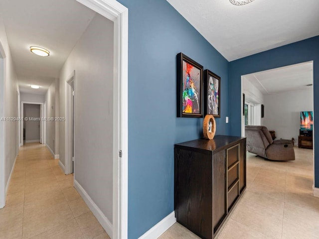 13530 SW 77th Ave, Pinecrest, FL 33156 - corridor featuring light tile patterned flooring and baseboards