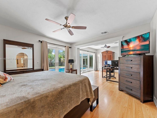13530 SW 77th Ave, Pinecrest, FL 33156 - bedroom with french doors, access to outside, light wood-style flooring, an office area, and a ceiling fan