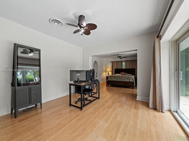 13530 SW 77th Ave, Pinecrest, FL 33156 - bedroom with a desk, light wood-style floors, access to outside, arched walkways, and ceiling fan