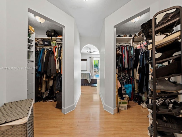 13530 SW 77th Ave, Pinecrest, FL 33156 - spacious closet with a ceiling fan and light wood-type flooring