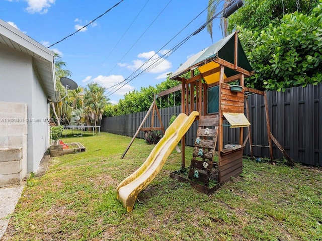 13530 SW 77th Ave, Pinecrest, FL 33156 - view of play area with a trampoline and a fenced backyard