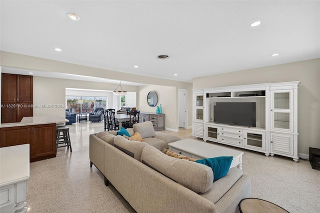 6201 SW 3rd St, Plantation, FL 33317 - living area with dark aggregate flooring and recessed lighting