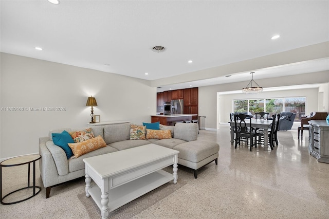 6201 SW 3rd St, Plantation, FL 33317 - living area featuring dark speckled floor, recessed lighting, and a chandelier