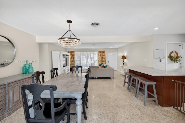 6201 SW 3rd St, Plantation, FL 33317 - dining room with dark speckled floor, a chandelier, and recessed lighting