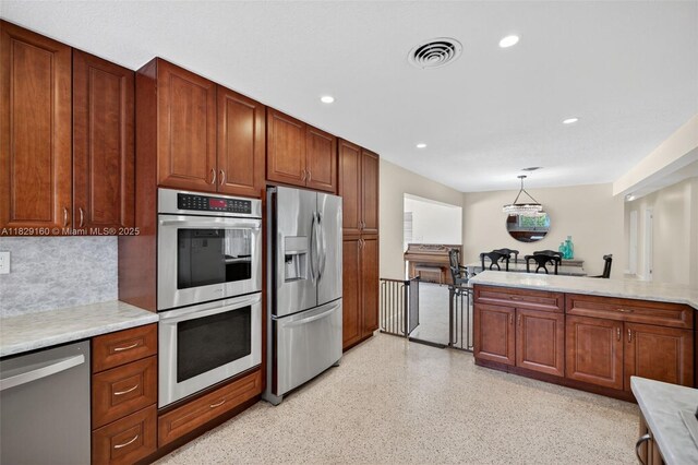 6201 SW 3rd St, Plantation, FL 33317 - kitchen with appliances with stainless steel finishes, light countertops, backsplash, dark speckled floor, and recessed lighting