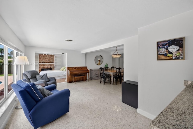 6201 SW 3rd St, Plantation, FL 33317 - living area with dark aggregate flooring and a fireplace