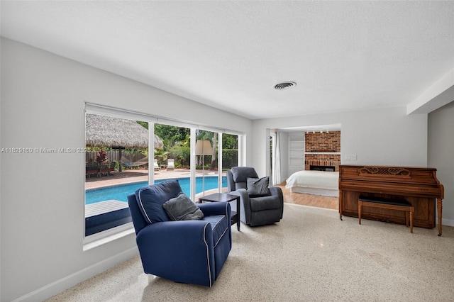 6201 SW 3rd St, Plantation, FL 33317 - living area with baseboards and a brick fireplace
