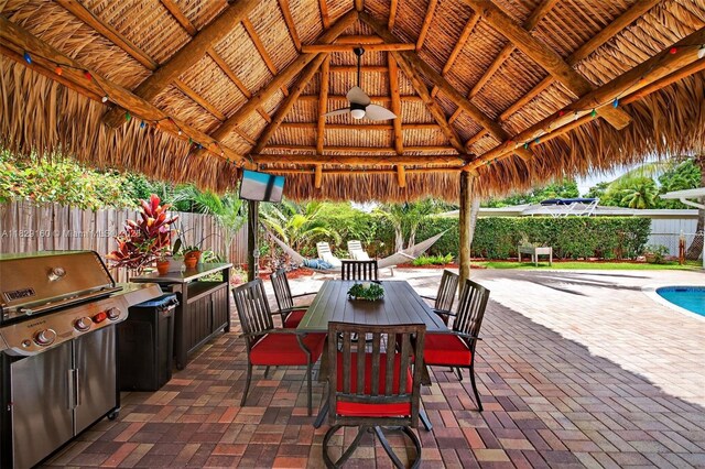 6201 SW 3rd St, Plantation, FL 33317 - fenced backyard with a gazebo, a grill, a patio area, and outdoor dining area