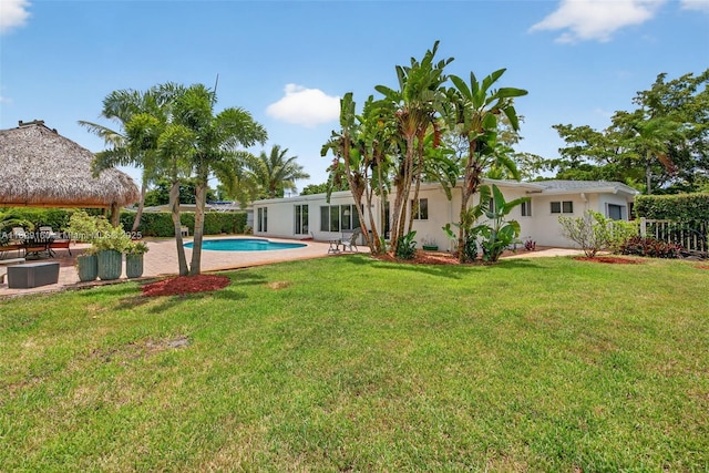 6201 SW 3rd St, Plantation, FL 33317 - view of grassy yard with an outdoor pool and a patio
