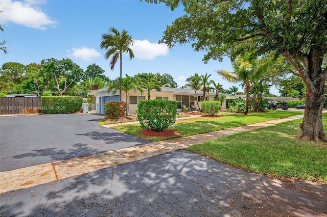 6201 SW 3rd St, Plantation, FL 33317 - view of front of property featuring asphalt driveway, stucco siding, and an attached garage