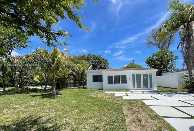 1401 NE 178th St, North Miami Beach, FL 33162 - rear view of property featuring french doors and stucco siding