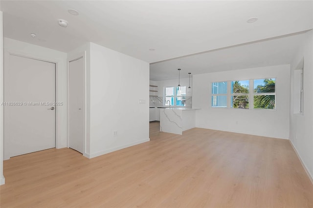 844 SE 12th Ct Unit 8, Fort Lauderdale, FL 33316 - unfurnished room with light wood-style flooring and a smoke detector