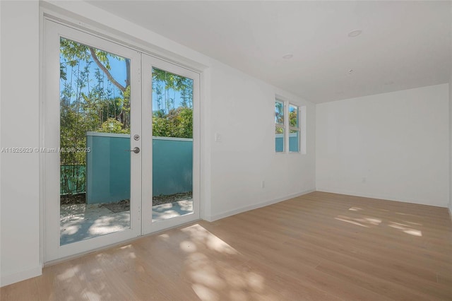 844 SE 12th Ct Unit 8, Fort Lauderdale, FL 33316 - unfurnished room with wood finished floors and french doors