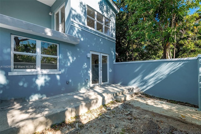 844 SE 12th Ct Unit 8, Fort Lauderdale, FL 33316 - view of property exterior featuring stucco siding and a patio