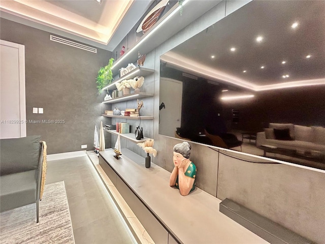 2301 Collins Ave Unit 1634/1635, Miami Beach, FL 33139 - cinema room featuring a tray ceiling, recessed lighting, and concrete flooring