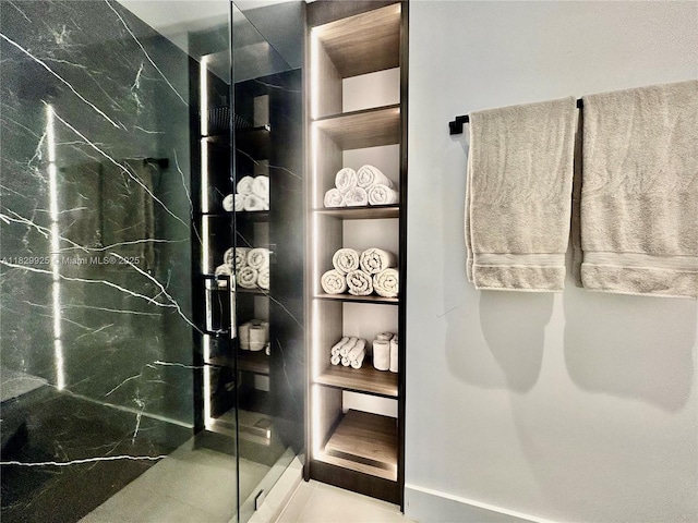 2301 Collins Ave Unit 1634/1635, Miami Beach, FL 33139 - full bathroom with a marble finish shower and built in features