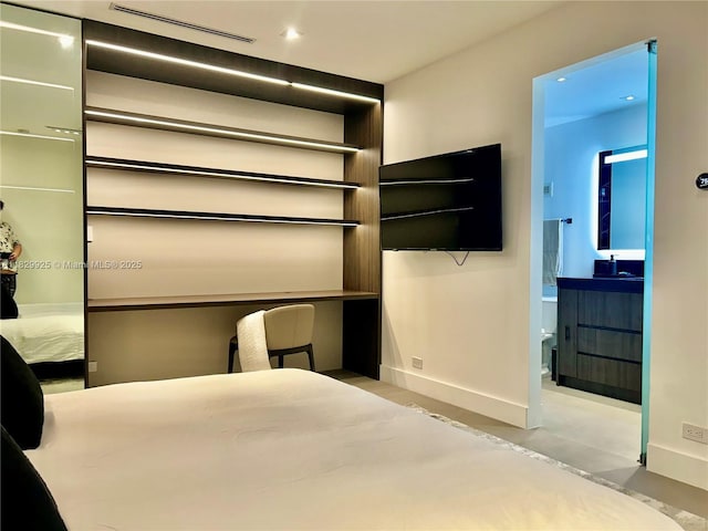 2301 Collins Ave Unit 1634/1635, Miami Beach, FL 33139 - unfurnished bedroom featuring finished concrete flooring and ensuite bathroom