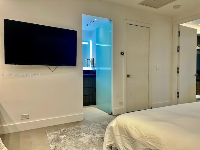 2301 Collins Ave Unit 1634/1635, Miami Beach, FL 33139 - bedroom featuring tile patterned floors and ensuite bath