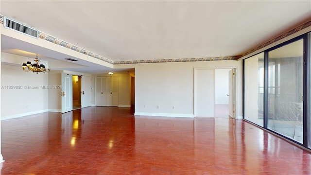 11113 Biscayne Blvd Unit 2056, Miami, FL 33181 - unfurnished room with a chandelier and wood finished floors