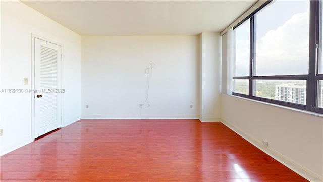 11113 Biscayne Blvd Unit 2056, Miami, FL 33181 - spare room with wood finished floors and baseboards