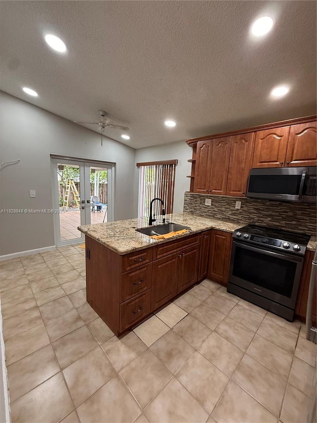 19926 NW 67th Pl, Hialeah, FL 33015 - kitchen with appliances with stainless steel finishes, french doors, decorative backsplash, a peninsula, and recessed lighting