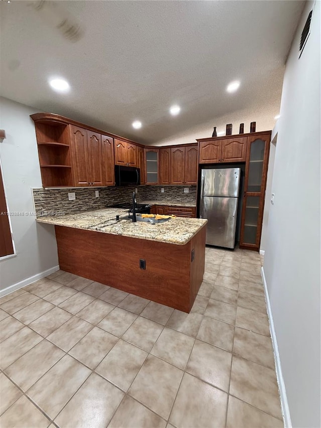 19926 NW 67th Pl, Hialeah, FL 33015 - kitchen featuring freestanding refrigerator, black microwave, a peninsula, open shelves, and backsplash