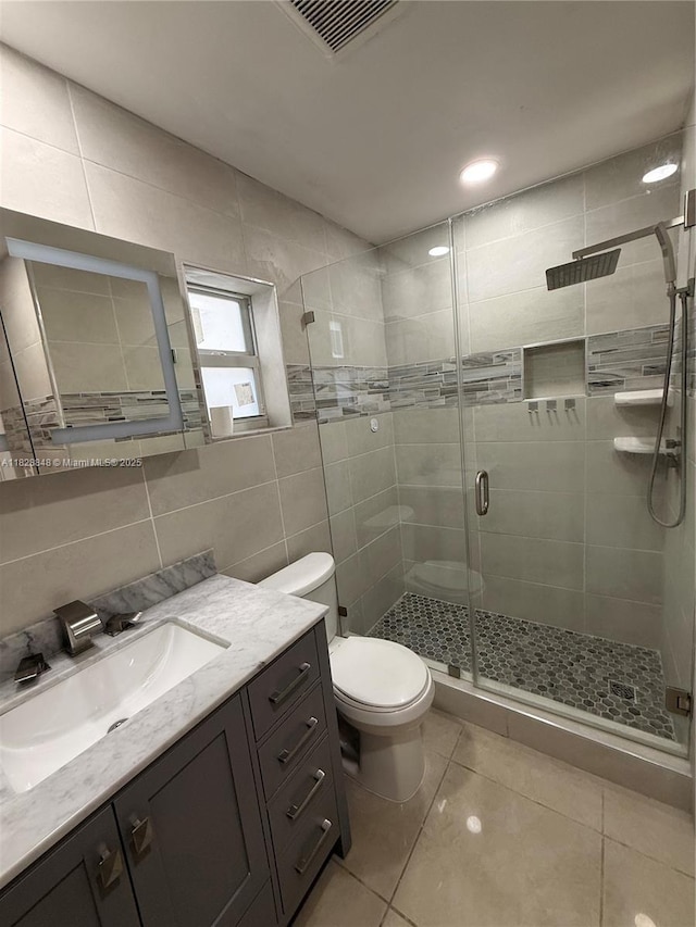 19926 NW 67th Pl, Hialeah, FL 33015 - bathroom featuring vanity, tile walls, a shower stall, and tile patterned floors