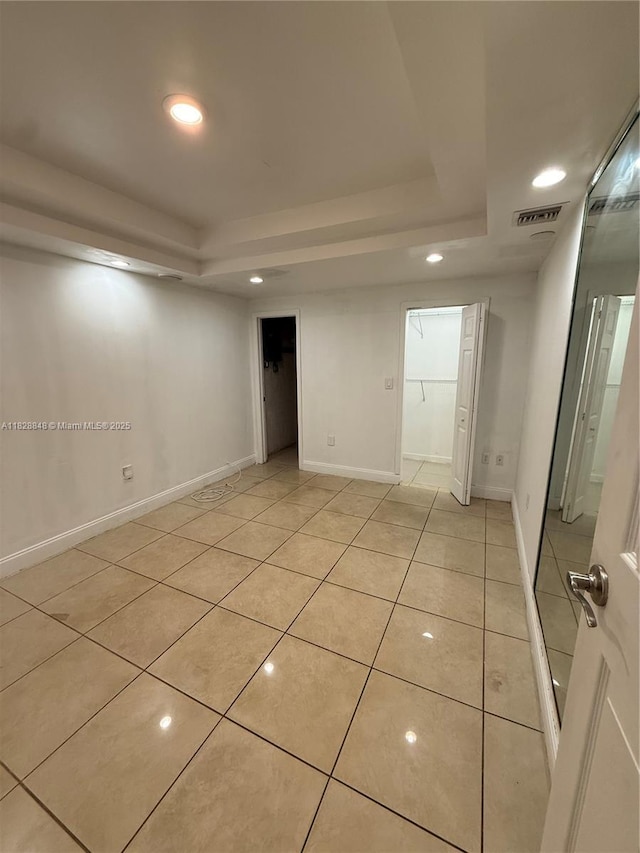 19926 NW 67th Pl, Hialeah, FL 33015 - spare room featuring a tray ceiling, light tile patterned floors, and recessed lighting