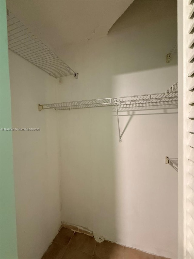 19926 NW 67th Pl, Hialeah, FL 33015 - spacious closet with tile patterned flooring