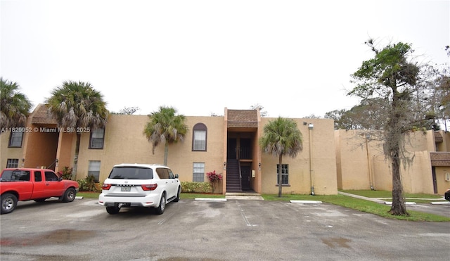 4231 NW 19th St Unit 256, Lauderhill, FL 33313 - view of front facade featuring uncovered parking and stucco siding