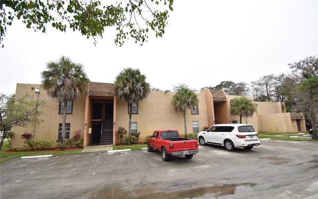 4231 NW 19th St Unit 256, Lauderhill, FL 33313 - townhome / multi-family property with uncovered parking and stucco siding