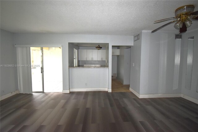 4231 NW 19th St Unit 256, Lauderhill, FL 33313 - unfurnished living room with ceiling fan, dark wood-style floors, and a textured ceiling