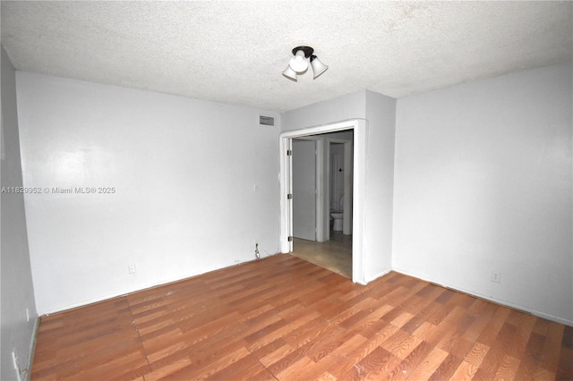 4231 NW 19th St Unit 256, Lauderhill, FL 33313 - unfurnished room with wood finished floors and a textured ceiling