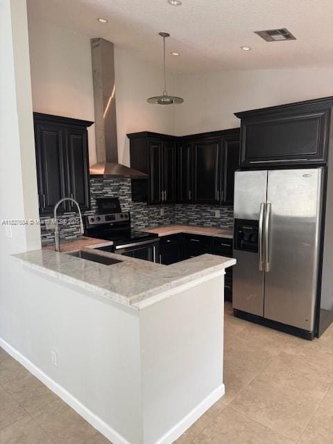 11224 Sacco Dr, Boca Raton, FL 33428 - kitchen featuring appliances with stainless steel finishes, dark cabinetry, wall chimney exhaust hood, tasteful backsplash, and high vaulted ceiling