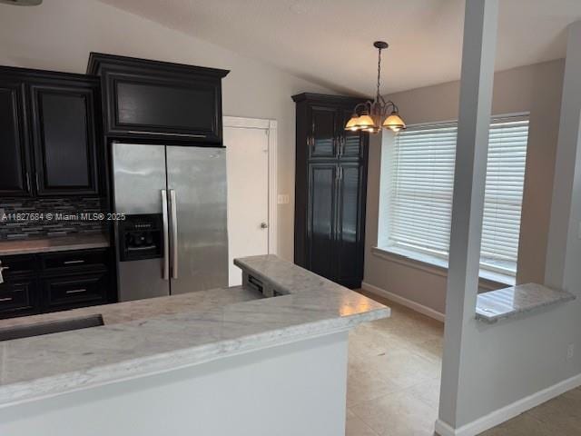 11224 Sacco Dr, Boca Raton, FL 33428 - kitchen with stainless steel fridge with ice dispenser, dark cabinets, a chandelier, lofted ceiling, and decorative light fixtures