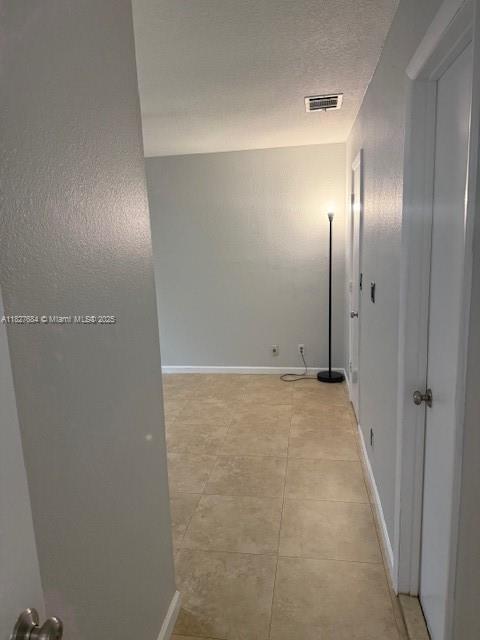 11224 Sacco Dr, Boca Raton, FL 33428 - hall featuring baseboards and light tile patterned floors