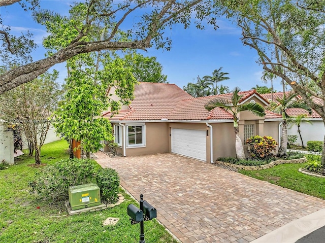 321 NW 100th Ave, Plantation, FL 33324 - view of front of property featuring stucco siding, an attached garage, driveway, and a tiled roof