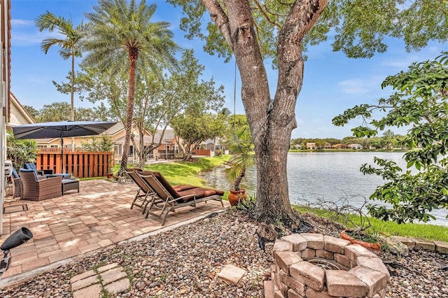 321 NW 100th Ave, Plantation, FL 33324 - view of yard featuring a fire pit, a patio, and a water view
