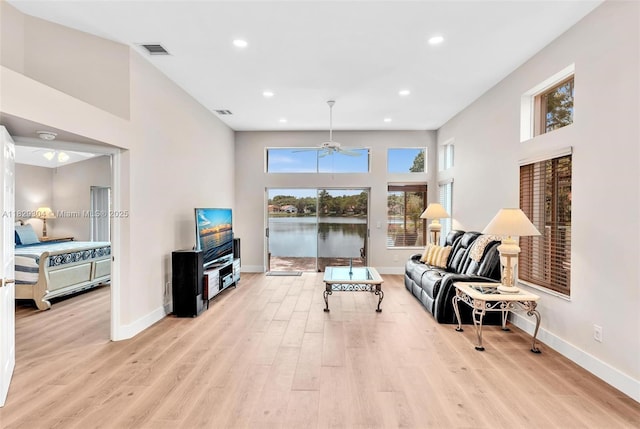 321 NW 100th Ave, Plantation, FL 33324 - living room featuring light wood-style floors, a ceiling fan, and recessed lighting