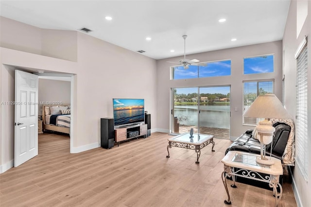 321 NW 100th Ave, Plantation, FL 33324 - living area with light wood-type flooring, a ceiling fan, recessed lighting, and a towering ceiling