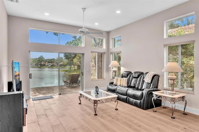 321 NW 100th Ave, Plantation, FL 33324 - living room featuring ceiling fan, plenty of natural light, light wood-type flooring, recessed lighting, and a towering ceiling