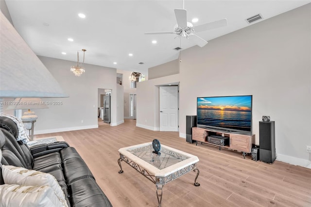 321 NW 100th Ave, Plantation, FL 33324 - living area featuring a towering ceiling, light wood-style floors, recessed lighting, a ceiling fan, and a chandelier
