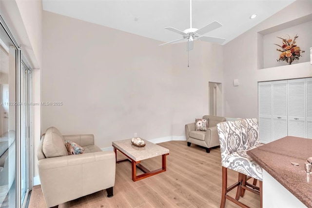 321 NW 100th Ave, Plantation, FL 33324 - living area with high vaulted ceiling, a ceiling fan, light wood-style flooring, and recessed lighting