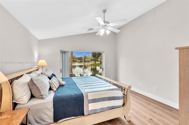 321 NW 100th Ave, Plantation, FL 33324 - bedroom featuring wood finished floors, a water view, access to exterior, vaulted ceiling, and a ceiling fan