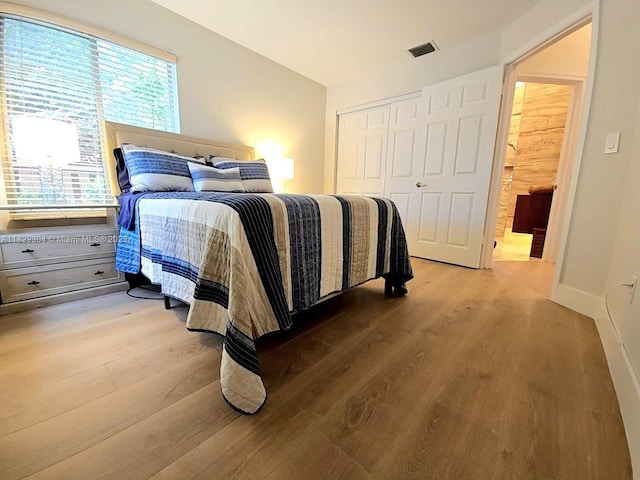 321 NW 100th Ave, Plantation, FL 33324 - bedroom with wood finished floors and a closet